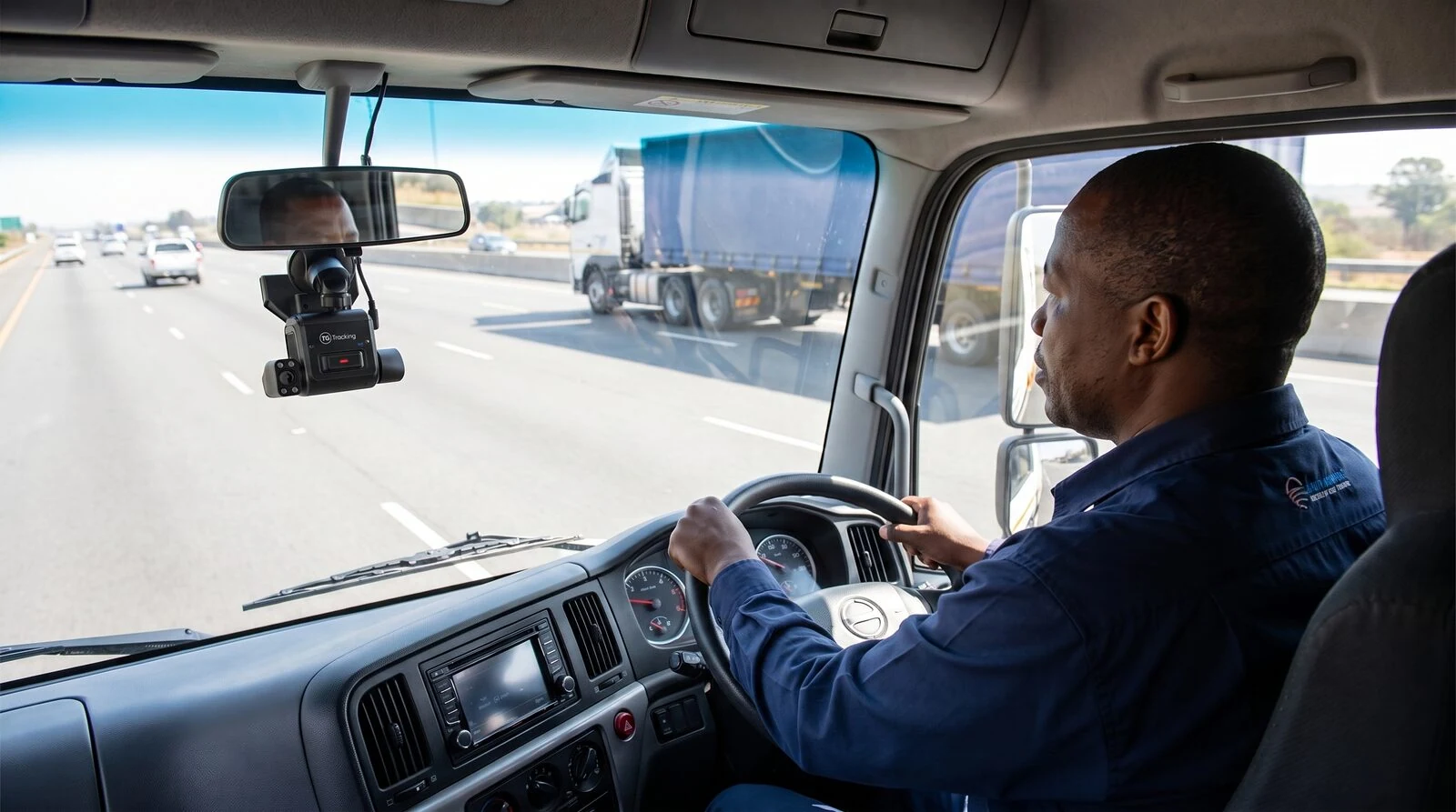 AI fleet camera showing ADAS road monitoring and DMS driver monitoring